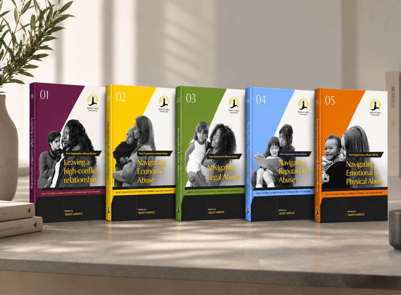 The five Harbour Lights Guide covers standing side by side on a desk.