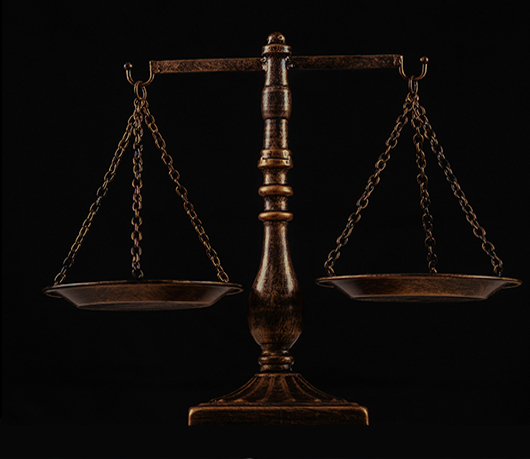 A set of scales, representing legal abuse.